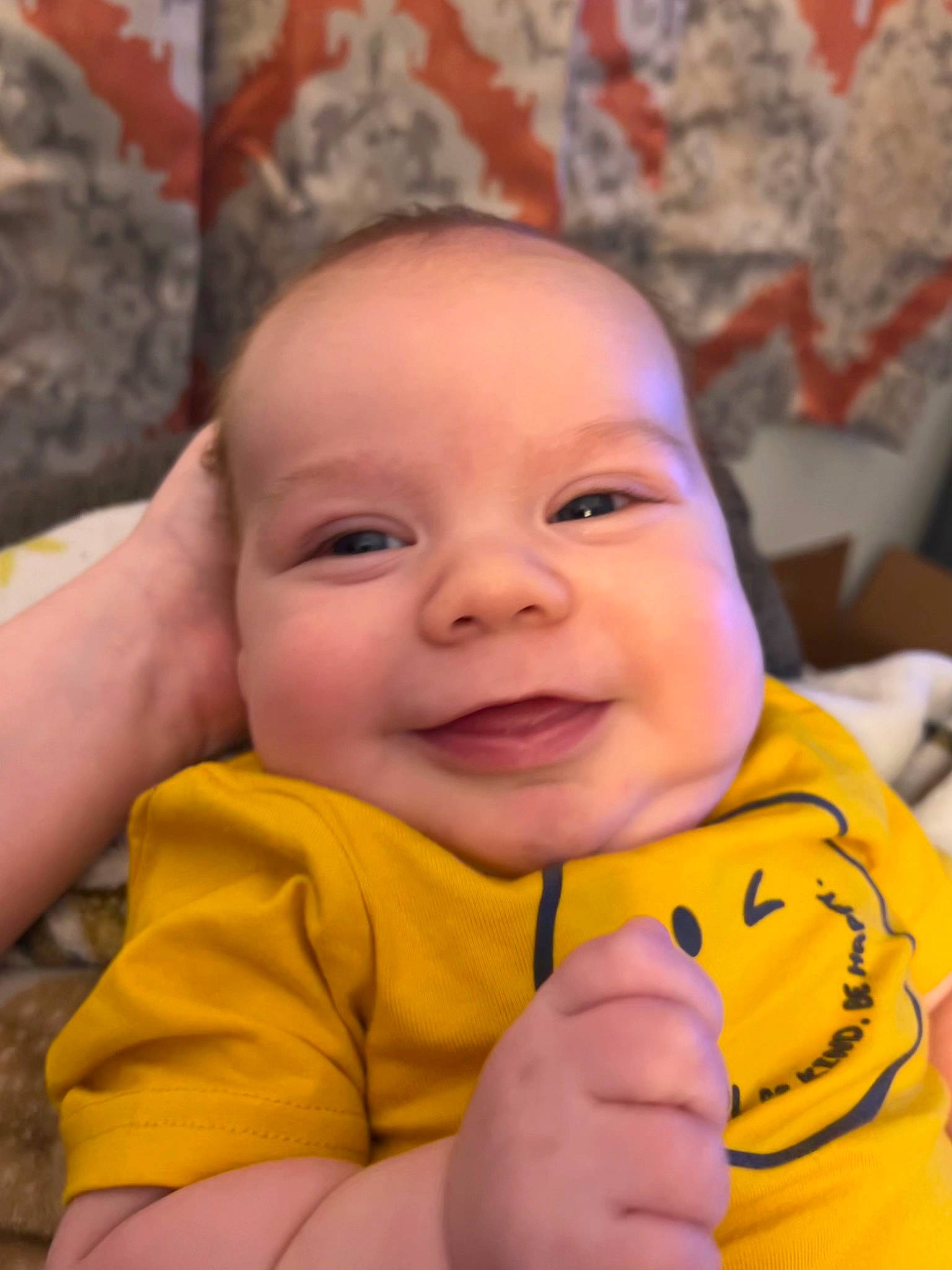 Sawyer joined the competition — help win amazing prizes! baby, baby_toddler_clothing, cheek, chin, dress, eye, eyebrow, facial_expression, finger, gesture, happy, head, iris, lip, mouth, nose, orange, person, skin, smile