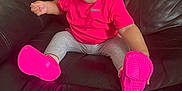 Khalesei is registered to the contest to win money with this photo: baby, casual, cheerful, child, comfortable, cute, footwear, happy, indoors, leather_couch, leggings, person, pink_bow, pink_shirt, pink_shoes, portrait, sitting, small_hands, smiling, young_child