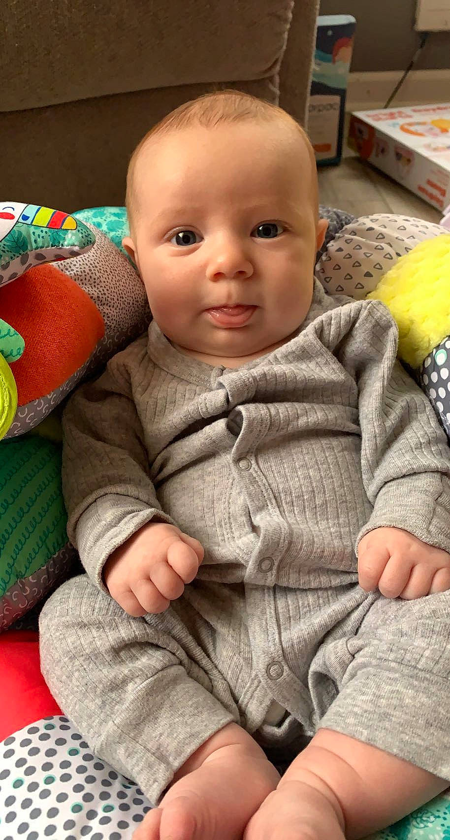 Maleah is registered to the contest to win money with this photo: baby, baby_toddler_clothing, cheek, child, clothing, comfort, finger, floor, flooring, head, human, iris, mouth, nose, outerwear, person, skin, sleeve, textile, thumb