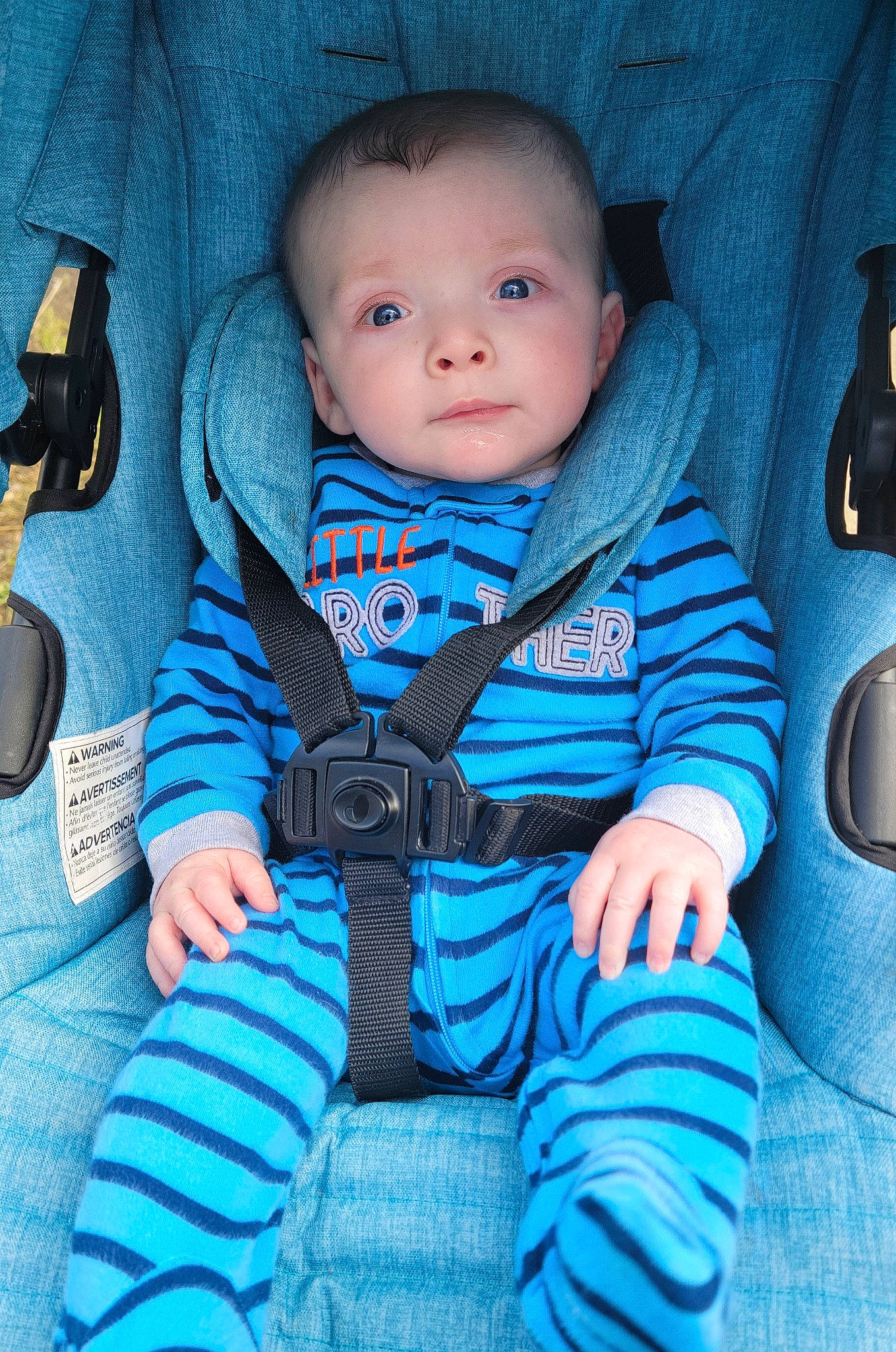Cooper is registered to the contest to win money with this photo: auto_part, baby, baby_products, baby_toddler_clothing, blue, car_seat, cheek, child, comfort, cool, electric_blue, finger, flash_photography, head, linens, person, purple, sitting, sleeve, smile