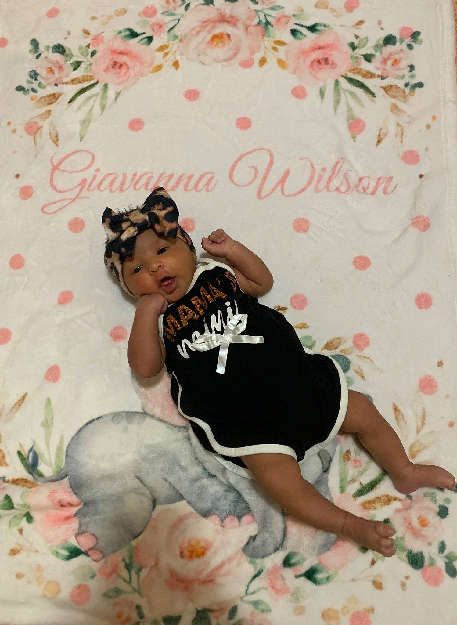 Giavanna is registered to the contest to win money with this photo: baby_toddler_clothing, barefoot, child, comfort, flooring, font, foot, happy, headwear, linens, magenta, pattern, person, petal, pink, room, sitting, sleeve, t_shirt, textile