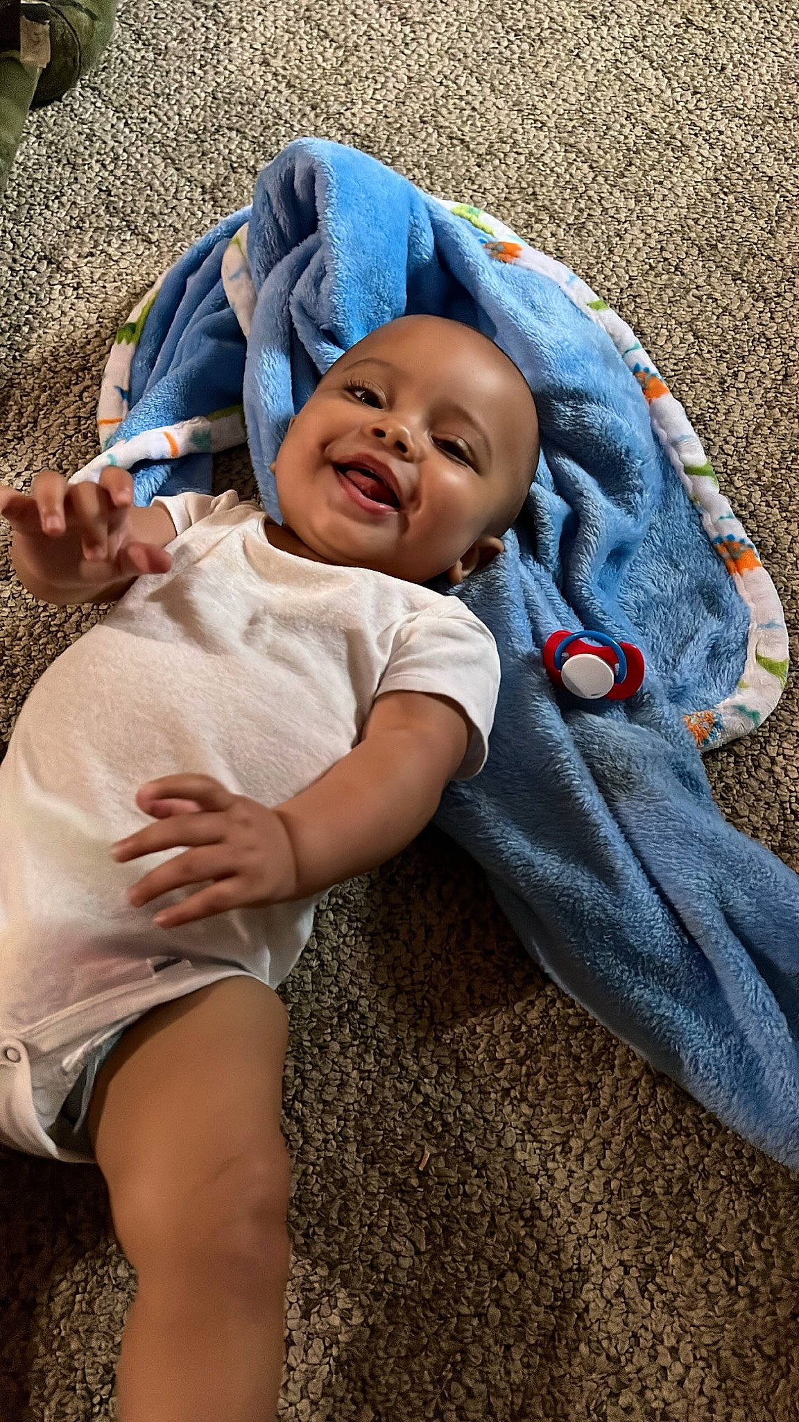 Josiah is registered to the contest to win money with this photo: baby, baby_toddler_clothing, cheek, child, comfort, electric_blue, eye, foot, fun, grass, happy, hat, headwear, human_leg, person, plant, sitting, skin, smile, sun_hat