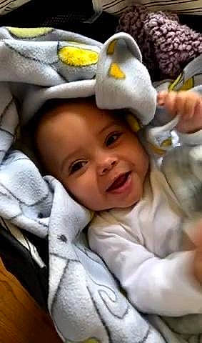 Josiah is registered to the contest to win money with this photo: baby, baby_carriage, baby_products, baby_safety, baby_sleeping, baby_toddler_clothing, cap, car_seat, cheek, child, comfort, fashion_accessory, finger, fun, gesture, happy, linens, person, smile, thumb