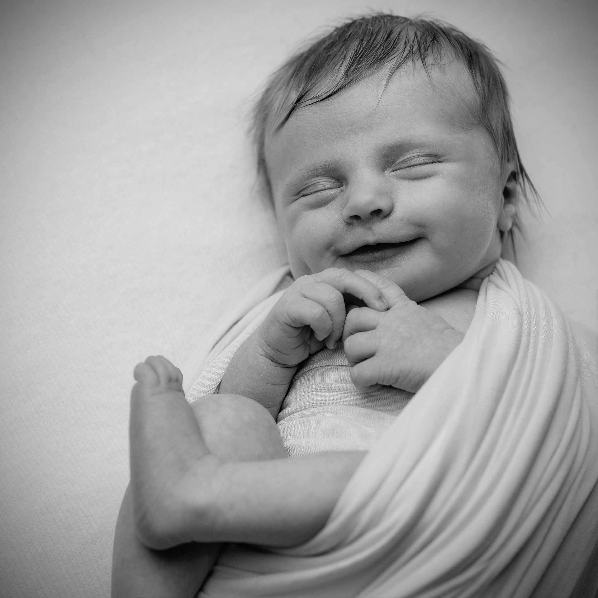 Darcie is registered to the contest to win money with this photo: baby, bodypart, face, finger, hand, happy, head, laughing, mouth, newborn, person, photography, portrait, sleeping, smile