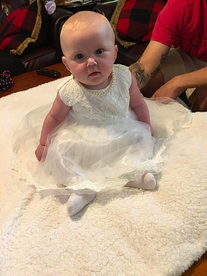 Riley is registered to the contest to win money with this photo: child, day, flooring, fun, girl, infant, leg, material, person, play, product, skin, smile, textile, toddler