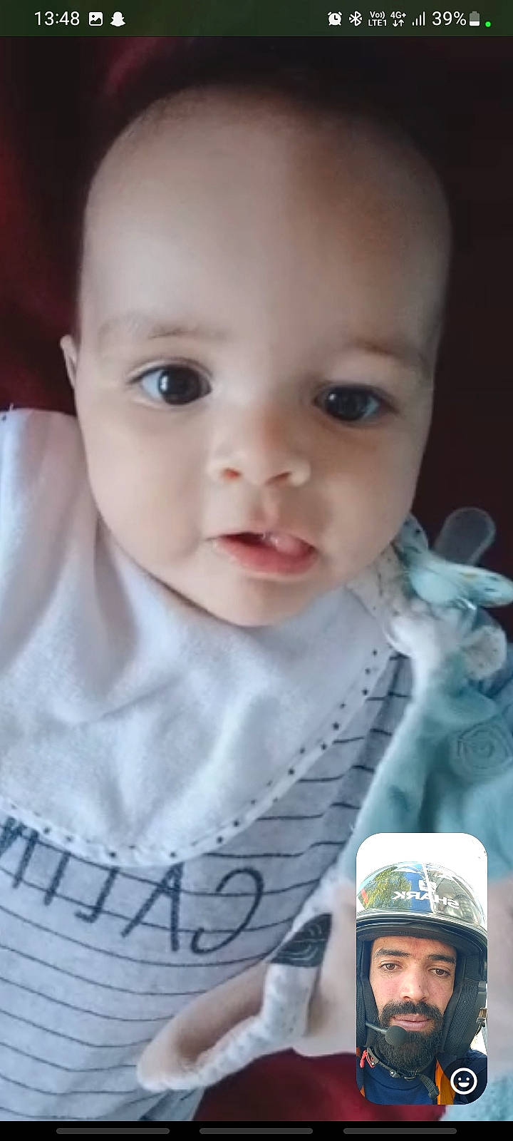 Djibril a rejoint le concours — aidez-le/la à gagner de superbes lots ! baby, baby_toddler_clothing, cheek, child, chin, dress, drinkware, eyebrow, eyelash, finger, happy, headwear, iris, lip, mouth, nail, nose, person, sitting, skin