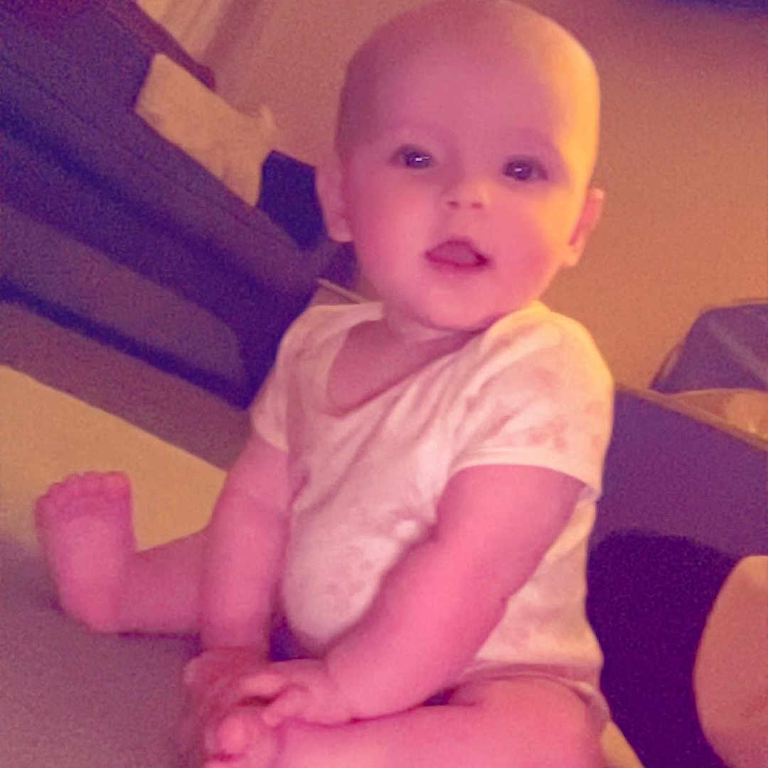 Mia is registered to the contest to win money with this photo: adult, architecture, baby, computer, computerhardware, couch, electronics, face, furniture, hardware, head, male, man, monitor, person, photography, portrait, screen, sitting, tv