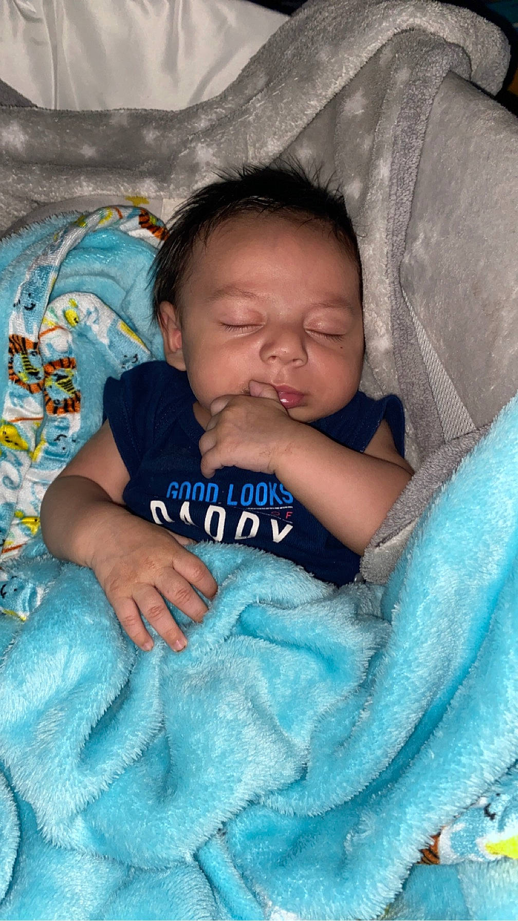 Sebastian is registered to the contest to win money with this photo: baby, baby_products, baby_toddler_clothing, bedtime, cheek, child, comfort, electric_blue, hairstyle, happy, iris, linens, mammal, nap, person, product, sitting, skin, textile, thumb