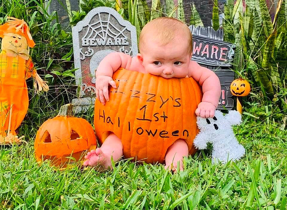 Isabella Grace is registered to the contest to win money with this photo: _and_melon_family, _gourd, baby, baby_toddler_clothing, calabaza, cucumber, cucurbita, gourd, grass, jack_o_lantern, lawn_ornament, orange, person, produce, pumpkin, squash, toy, trick_or_treat, vegetable, winter_squash