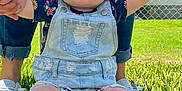 Autumn is registered to the contest to win money with this photo: baby, child, grass, denim_overalls, headband, adult, holding_hands, outdoor, sunny, footwear, ripped_jeans, fence, blue_sky, person, casual_clothing, barefoot, portrait, summer, nature, cute