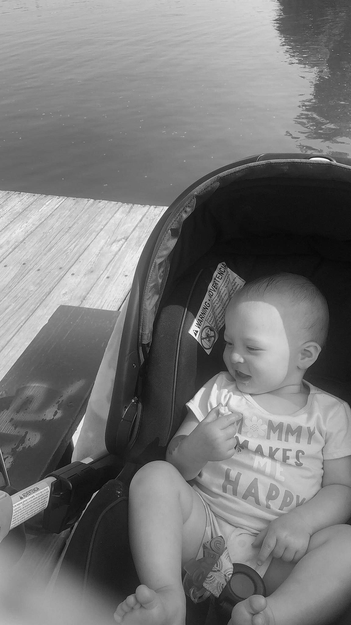 Azalea is registered to the contest to win money with this photo: baby, baby_carriage, baby_products, baby_toddler_clothing, black, black_and_white, child, comfort, eyewear, fun, grass, happy, monochrome, monochrome_photography, person, personal_protective_equipment, sitting, stock_photography, style, tints_and_shades