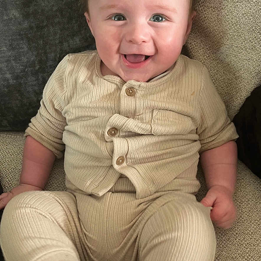 Oakley joined the competition — help win amazing prizes! baby, babylaughing, bodypart, clothing, face, finger, hand, happy, head, homedecor, laughing, mouth, newborn, pants, person, photography, portrait, sitting, smile, teeth