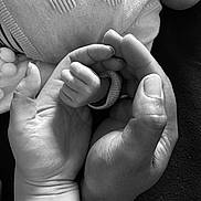 Rayan participe au concours pour gagner de l'argent avec cette photo : adult_hand, baby, baby_clothes, black_and_white, caring, close_up, comfort, family, fingers, hand, human, infant, knitwear, love, monochrome, portrait, skin, tenderness, texture, touch