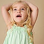 child, girl, blonde_hair, blue_eyes, mint_green_dress, arms_up, curly_hair, portrait, smiling, happy, looking_up, studio_background, light_skin, long_hair, cute, innocent, childhood, casual_clothing, expression, pose