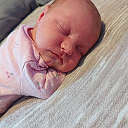 Lottie joined the competition — help win amazing prizes! baby, newborn, sleeping, pink_clothing, face, infant, blanket, soft_texture, cozy, peaceful, closeup, person, child, indoors, resting, head, cheeks, cute, toddler, sleep