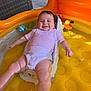 Aston is registered to the contest to win money with this photo: baby, infant, smiling, water, inflatable_pool, yellow, onesie, toy, bath_toy, child, happy, summer, outdoor, seat, plastic, reflection, skin, arm, face, leg