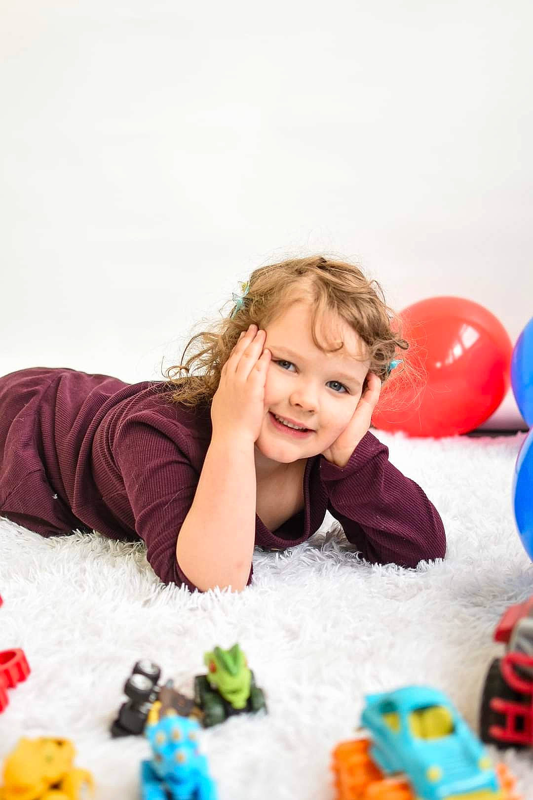 Addisyn is registered to the contest to win money with this photo: baby_playing_with_toys, baby_toys, balloon, blue, child, flooring, fun, happy, joy, leisure, magenta, person, plastic, play, recreation, room, sitting, smile, toddler, toy