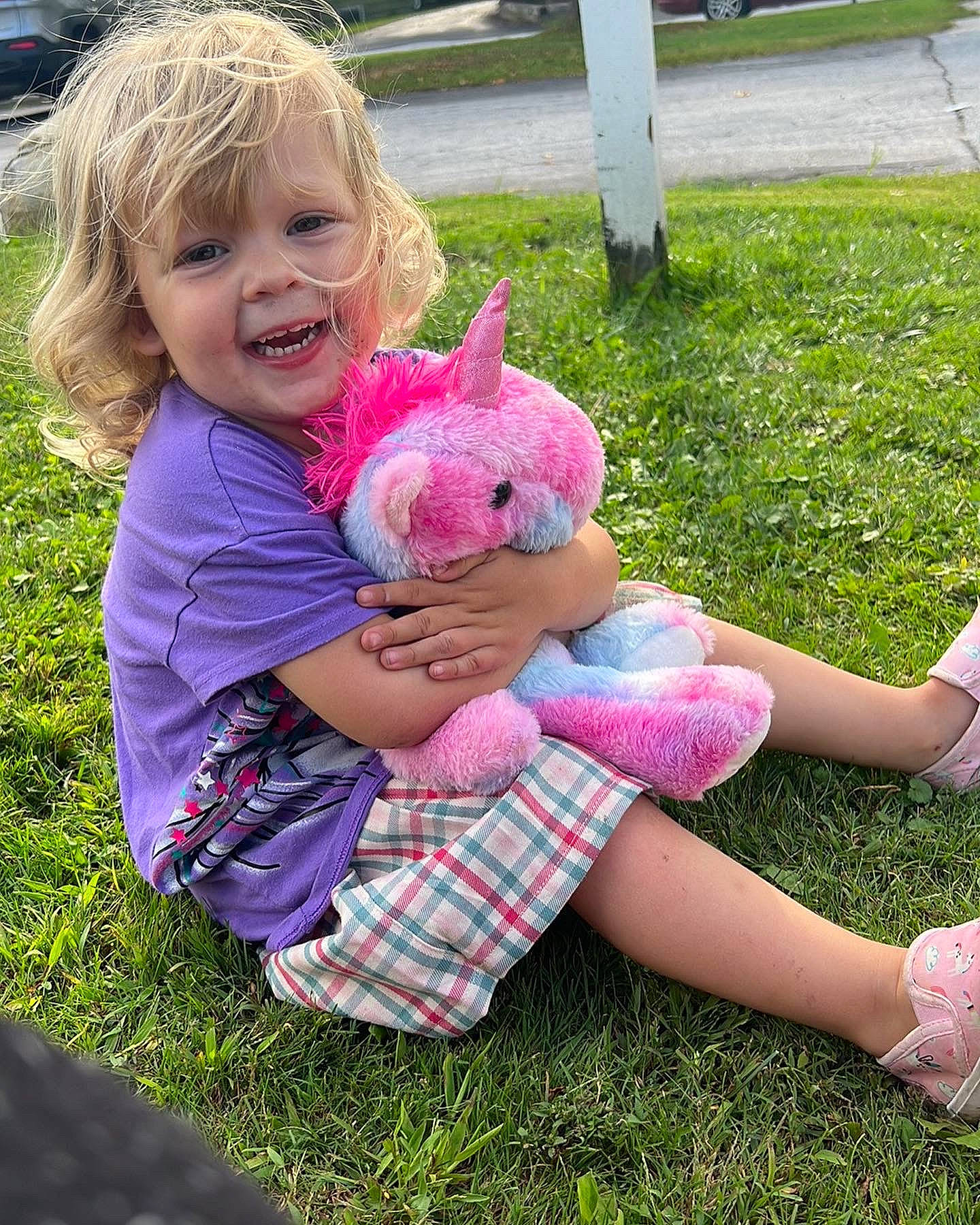Brynn joined the competition — help win amazing prizes! baby_toddler_clothing, child, finger, fun, grass, happy, joy, lawn, magenta, pattern, people_in_nature, person, pink, plant, play, recreation, sitting, smile, stuffed_toy, thumb