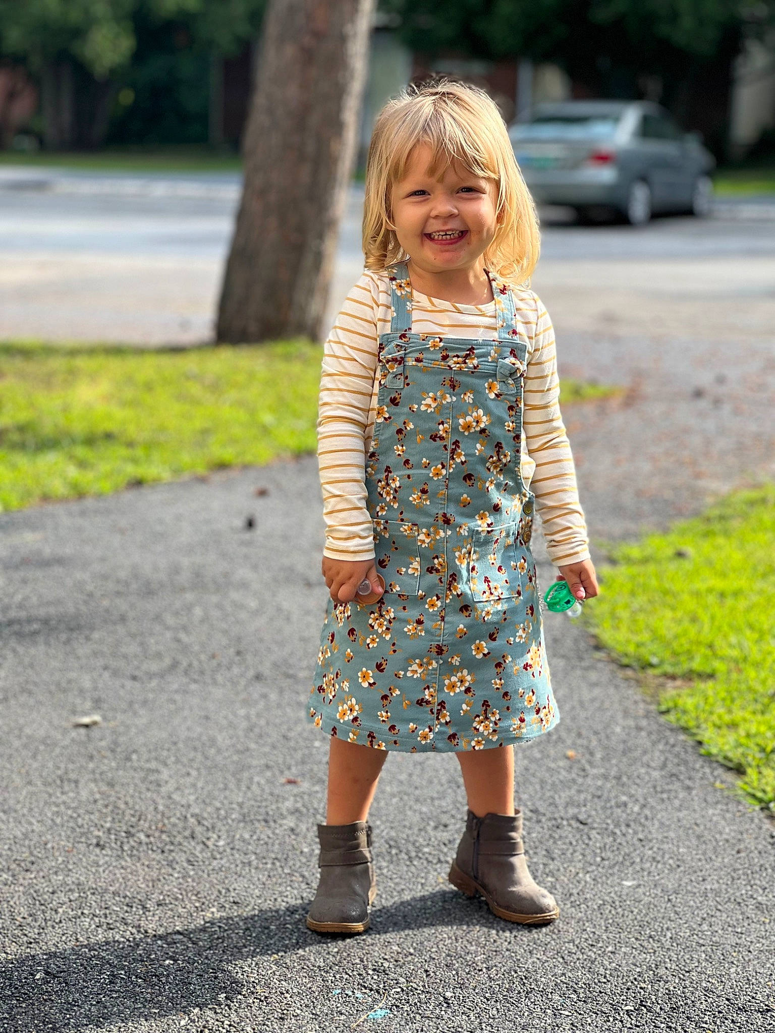 Brynn joined the competition — help win amazing prizes! asphalt, child, day_dress, dress, grass, hair, happy, joint, joy, leaf, leg, outerwear, pattern, people_in_nature, person, plant, road_surface, shoe, smile, textile