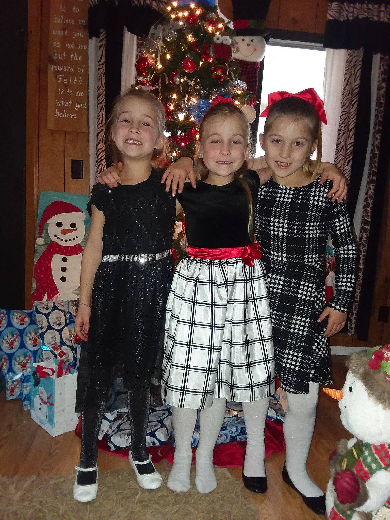 Aaliyah joined the competition — help win amazing prizes! christmas, christmas_decoration, christmas_tree, costume, day, design, event, fun, girl, holiday, joy, outerwear, pattern, person, plaid, product, standing, tartan, toddler, tradition