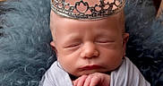 Kyyro joined the competition — help win amazing prizes! newborn, baby, crown, sleeping, wrapped, blanket, portrait, closeup, soft_texture, blue, gray, peaceful, infant, cute, resting, headwear, fuzzy, comfortable, indoors, decorative