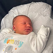 Azelia is registered to the contest to win money with this photo: newborn, baby, sleeping, infant, white_clothing, elephant, pillow, cute, cozy, soft, peaceful, child, closeup, indoors, portrait, resting, sleep, small, hands, babywear