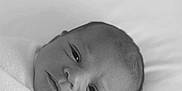 Azelia is registered to the contest to win money with this photo: baby, newborn, black_and_white, portrait, swaddled, blanket, infant, face, head, sleeping_area, soft, cute, lying_down, close_up, peaceful, newborn_baby, person, monochrome, indoors, calm