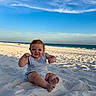 baby, child, sand, beach, ocean, sky, blue_sky, smile, happy, sitting, summer, vacation, sunlight, nature, outdoor, foot, waves, clouds, casual_clothing, cute