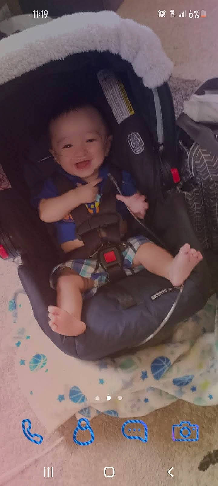 Karson is registered to the contest to win money with this photo: auto_part, automotive_exterior, baby, baby_products, baby_toddler_clothing, bag, car_seat, car_seat_cover, comfort, fun, lap, luggage_and_bags, person, recreation, shorts, sitting, smile, steering_wheel, thigh, toddler