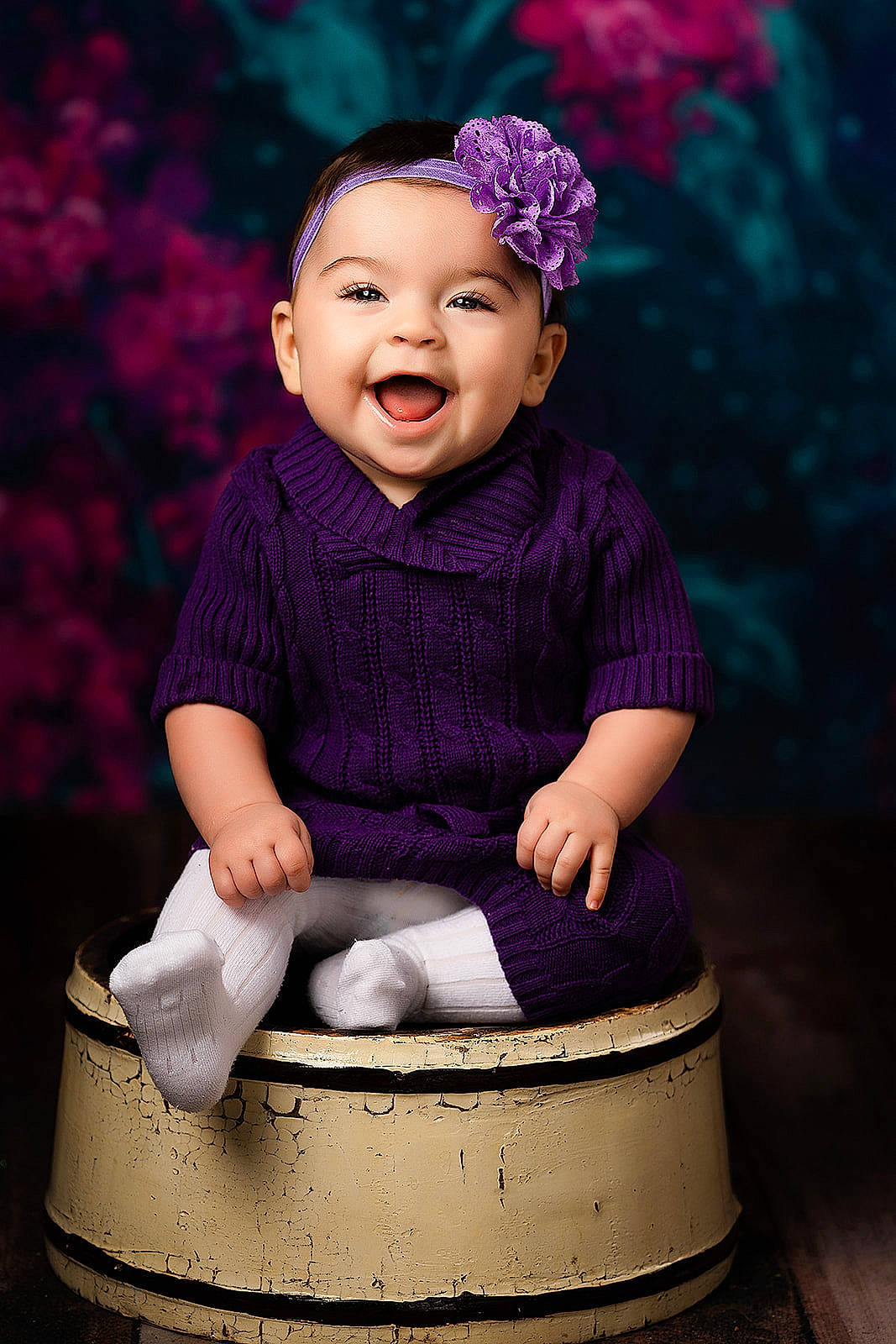 Emma is registered to the contest to win money with this photo: baby, cheek, child, child_model, flash_photography, happy, headgear, magenta, person, photo_shoot, photography, pink, portrait, portrait_photography, purple, sitting, smile, toddler