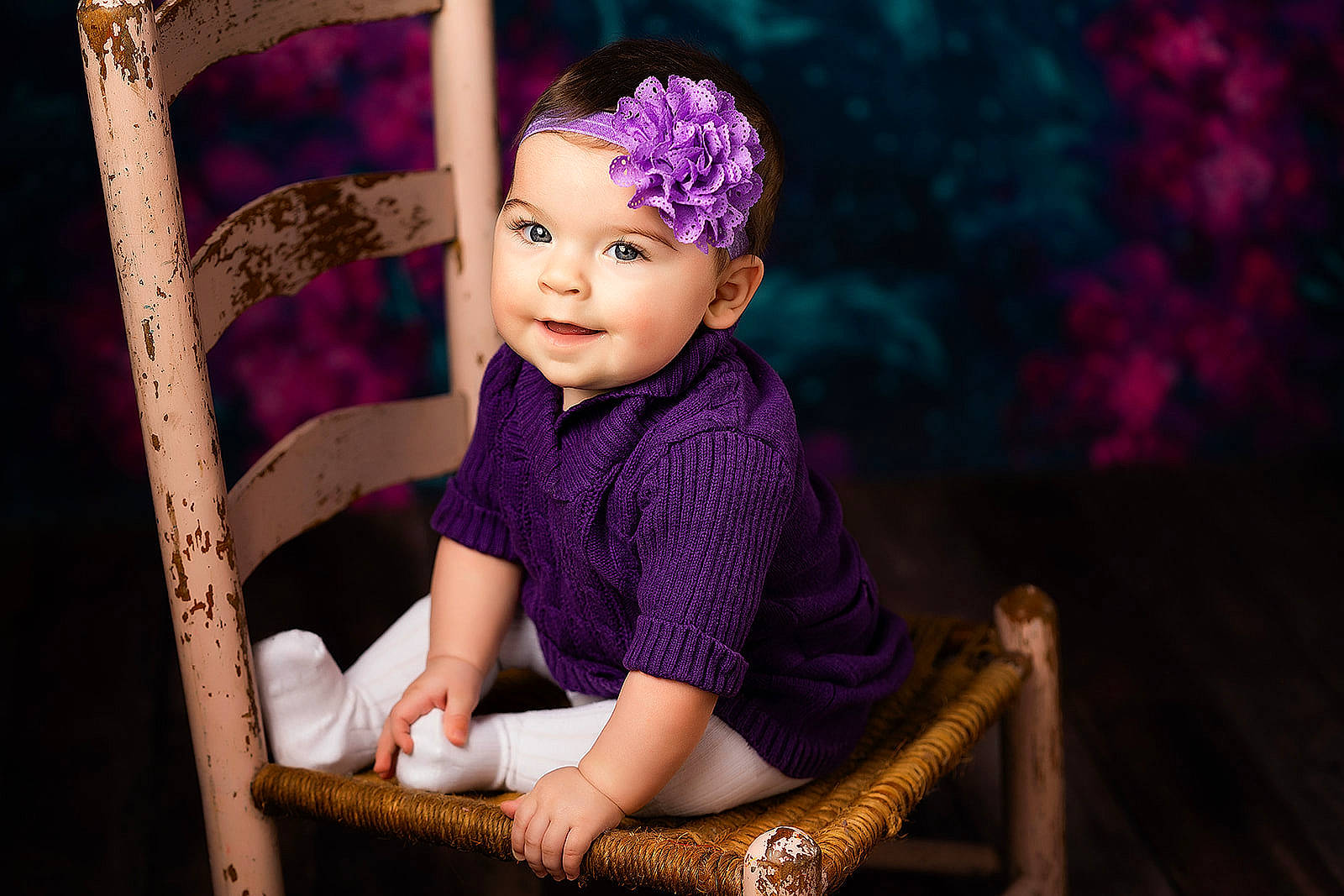 Emma is registered to the contest to win money with this photo: baby, baby_products, child, child_model, headgear, headwear, person, photography, portrait, portrait_photography, purple, sitting, toddler