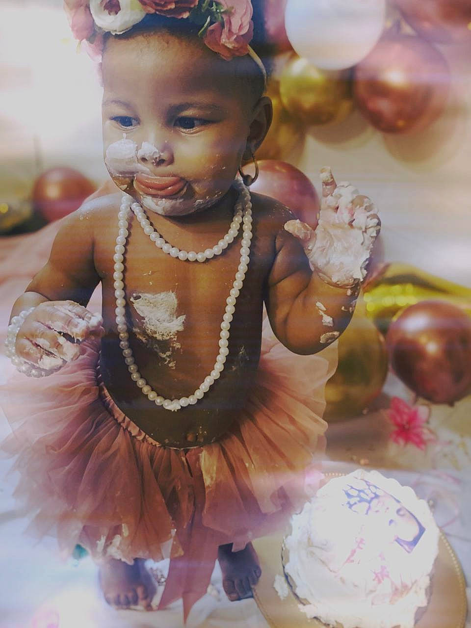 Daelynn joined the competition — help win amazing prizes! baby_toddler_clothing, baked_goods, cake, cake_decorating, chest, costume_accessory, cuisine, dairy, dessert, hair_accessory, headgear, headpiece, ingredient, kuchen, person, serveware, sugar_cake, sweetness, toddler, tradition