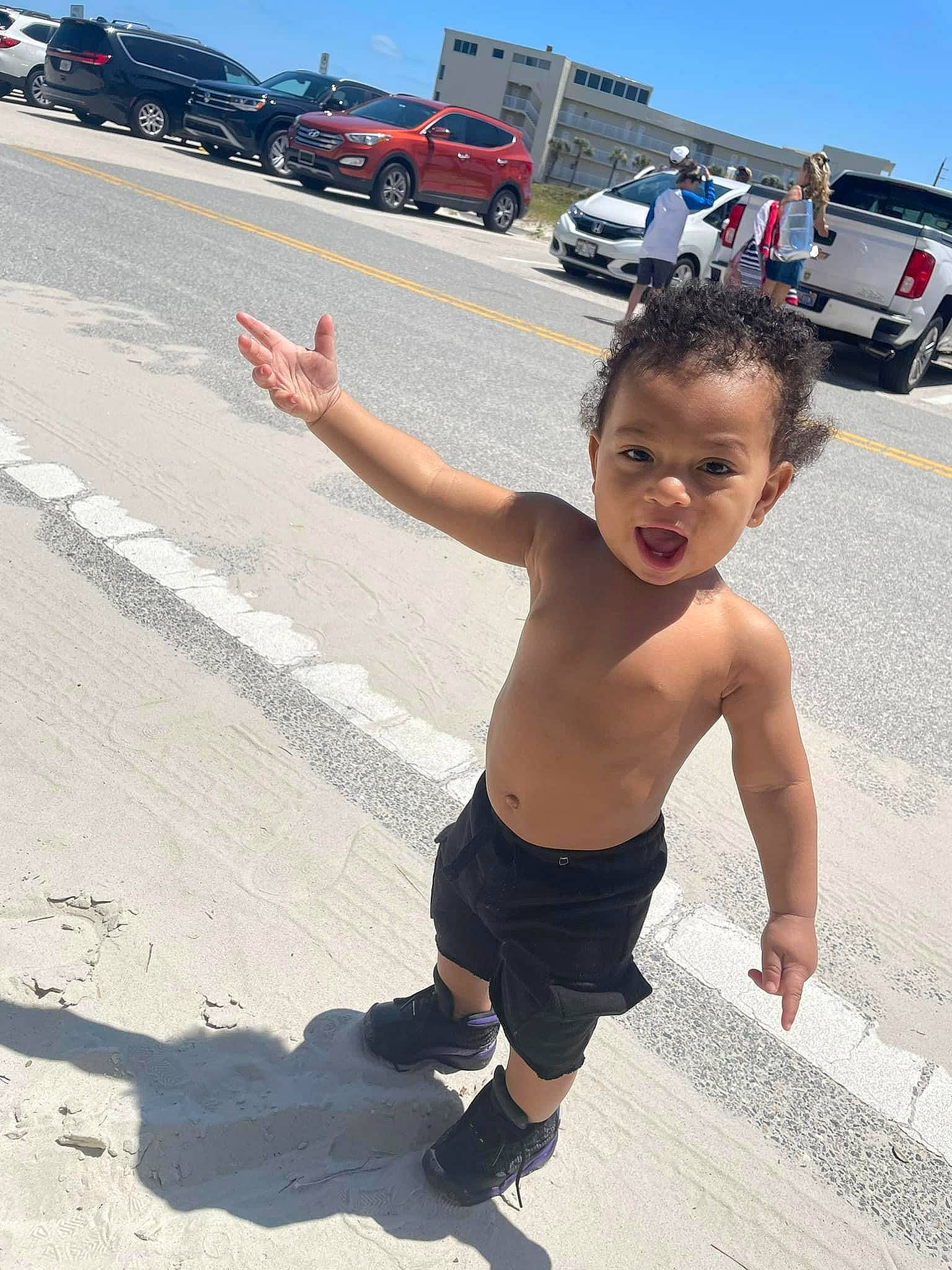 Kaisen is registered to the contest to win money with this photo: arm, asphalt, automotive_exterior, automotive_tire, barechested, bumper, car, event, fun, happy, motor_vehicle, pedestrian, person, recreation, road, road_surface, sky, tire, toddler, truck