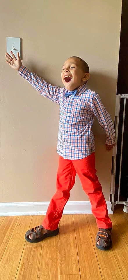 Mason is registered to the contest to win money with this photo: baby, child, child_model, clothing, cool, design, footwear, muscle, outerwear, pajamas, pattern, person, play, shoe, sleeve, standing, t_shirt, toddler, trousers