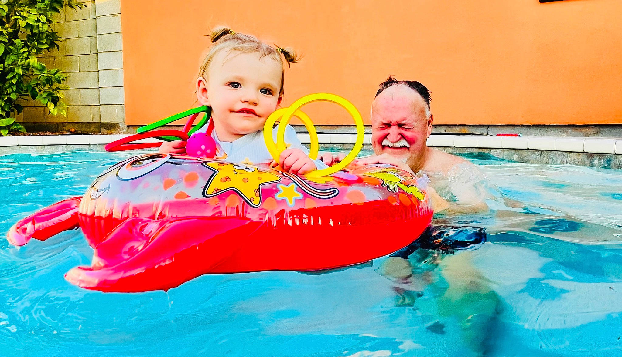 Dallas is registered to the contest to win money with this photo: aqua, baby_float, baby_toddler_clothing, bathing, beauty, fun, happy, inflatable, joy, leisure, person, personal_protective_equipment, plant, play, product, recreation, smile, summer, swimming_pool, swimwear