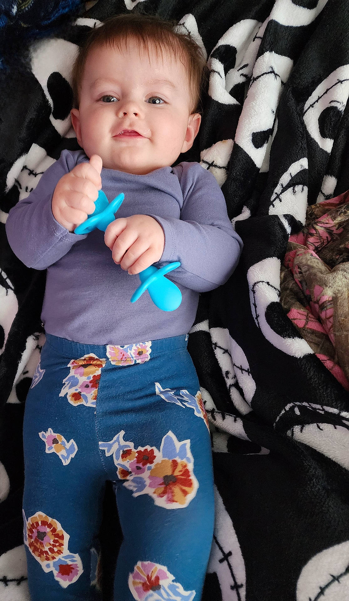 baby, bodypart, brush, clothing, couch, cutlery, device, face, finger, furniture, hand, head, homedecor, pants, person, photography, portrait, shorts, spoon, tool