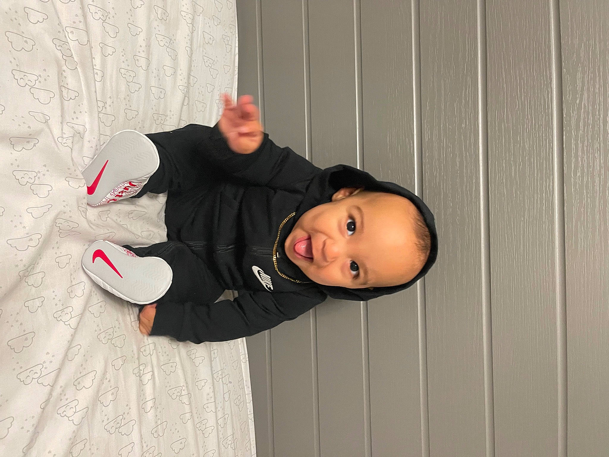 Michael joined the competition — help win amazing prizes! carmine, child, flash_photography, flooring, fun, jacket, outdoor_shoe, person, sitting, sleeve, smile, street_fashion, toddler, wood