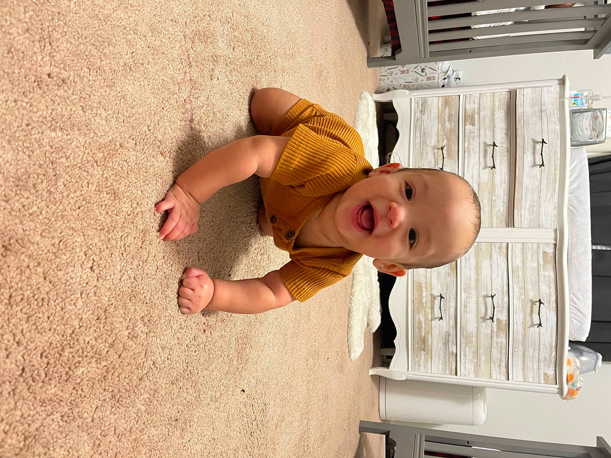 Malakai is registered to the contest to win money with this photo: baby, baby_laughing, baby_products, baby_safety, baby_toddler_clothing, building, child, facial_expression, flooring, fun, happy, hat, human_body, leg, nose, person, room, skin, smile, toddler
