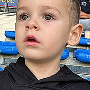 Matia a rejoint le concours — aidez-le/la à gagner de superbes lots ! black_clothing, boy, brown_eyes, casual, child, closeup, curious, expression, face, hoodie, indoors, logo, people, portrait, seats, short_hair, spectators, sports, stadium, young
