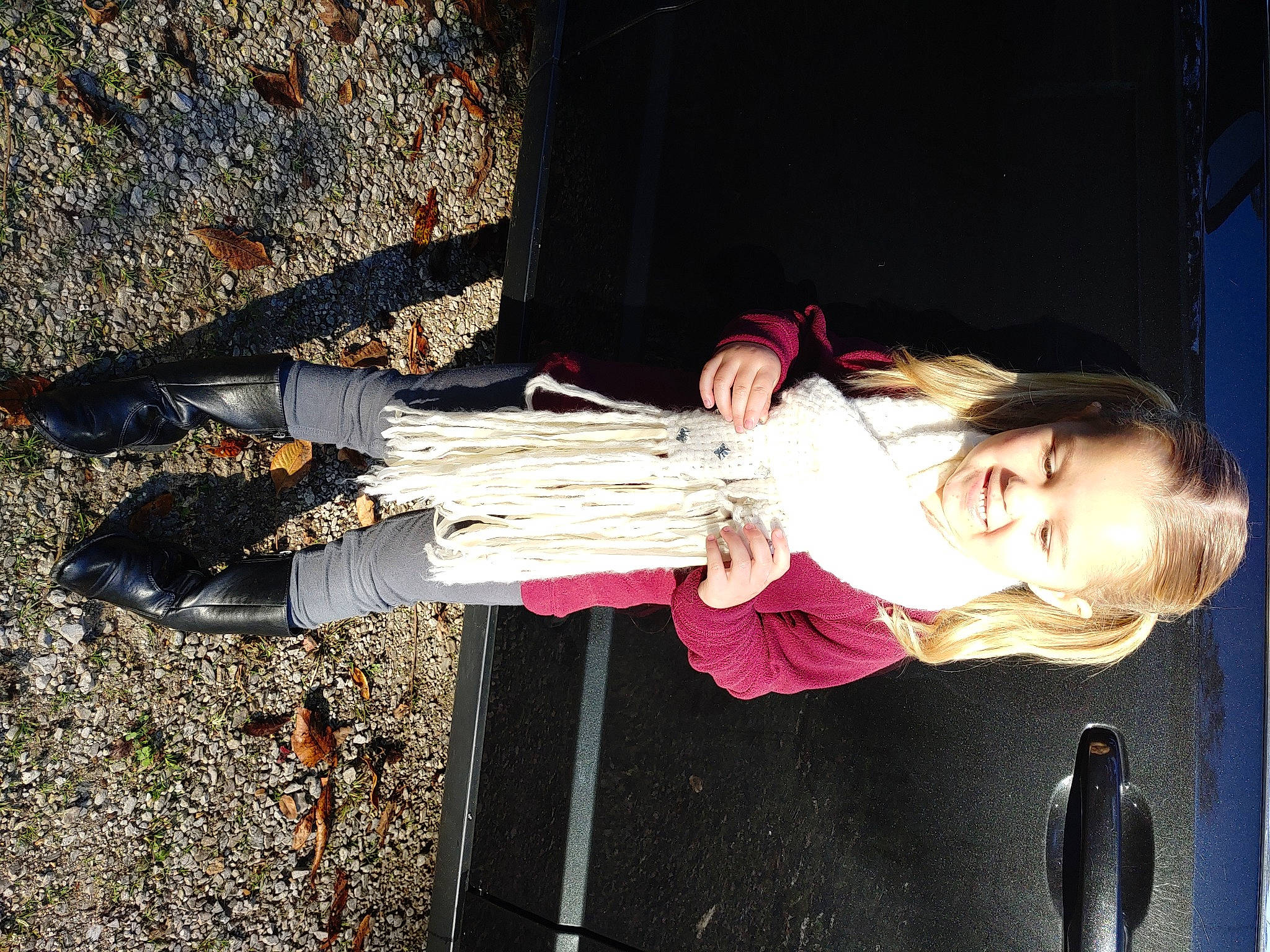 Chelsea is registered to the contest to win money with this photo: asphalt, fun, happy, joy, person, plant, road_surface, shadow, smile, street_fashion, toddler, tree