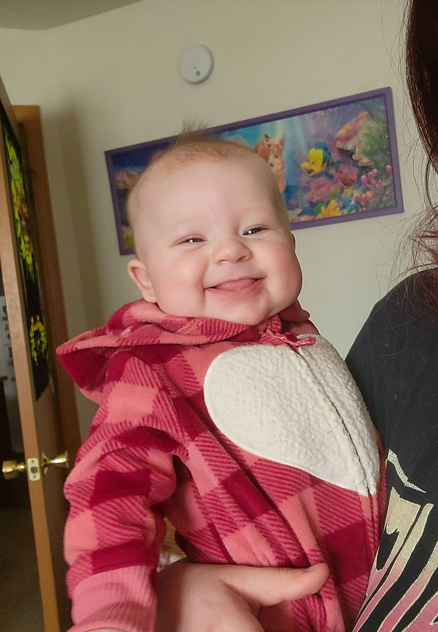 Charlee is registered to the contest to win money with this photo: baby, baby_products, baby_toddler_clothing, cheek, chin, clock, comfort, eye, happy, iris, joy, neck, person, picture_frame, pink, shoulder, sitting, skin, sleeve, smile