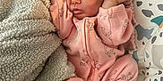 Stevie is registered to the contest to win money with this photo: baby, newborn, sleeping, pink_onesie, giraffe_print, blanket, soft_texture, infant, cute, cozy, child, peaceful, resting, baby_bedding, patterned, toddler, nursery, indoors, person, sleep