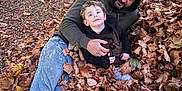 Chase joined the competition — help win amazing prizes! child, man, leaves, autumn, outdoor, nature, smile, hoodie, grass, fall, casual_clothing, joy, family, play, relaxation, person, seasonal, happy, fun, toddler