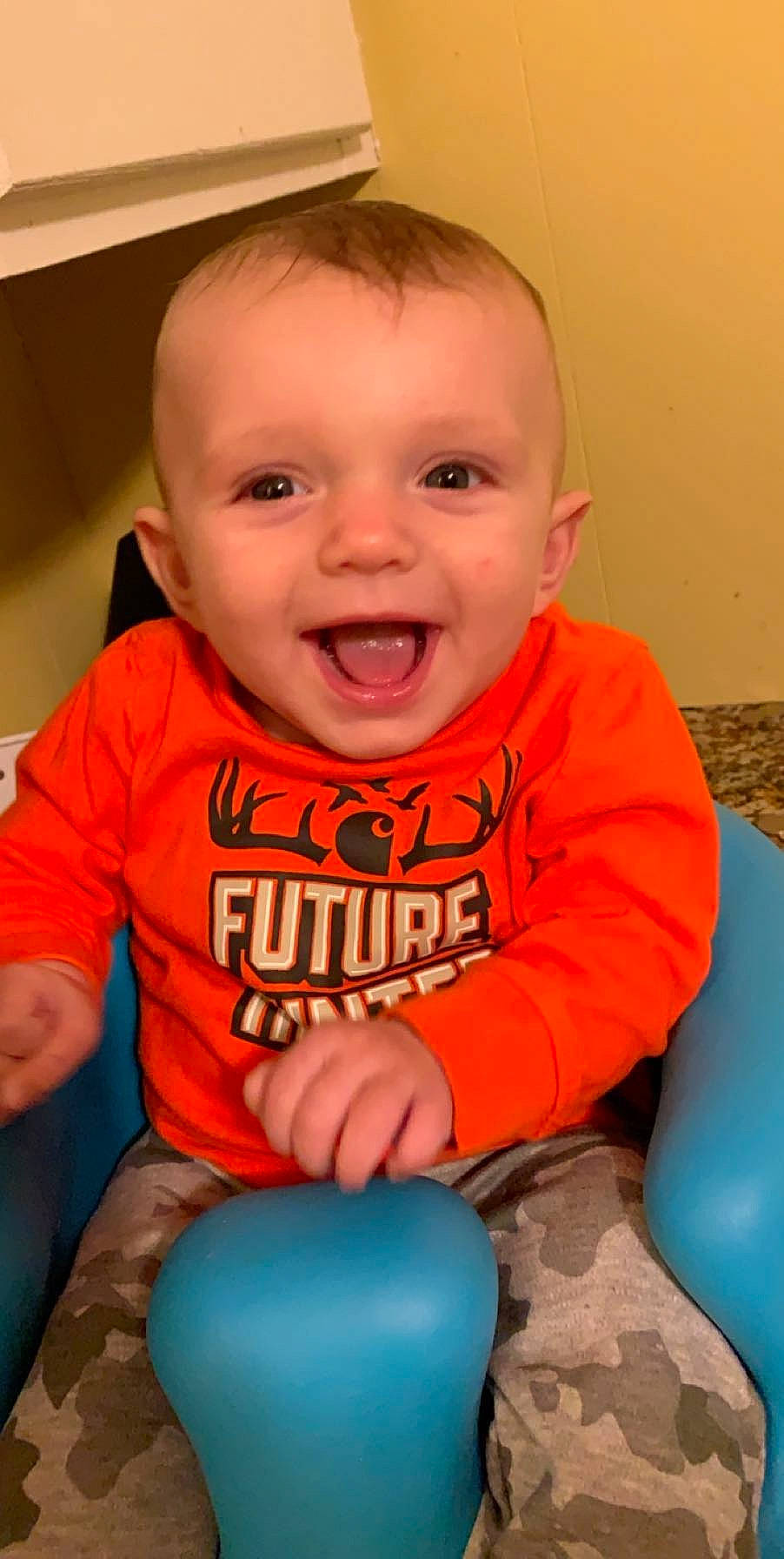 Jaxson is registered to the contest to win money with this photo: baby, baby_products, baby_toys, ball, child, facial_expression, fun, mouth, orange, person, play, sitting, smile, toddler, tummy_time