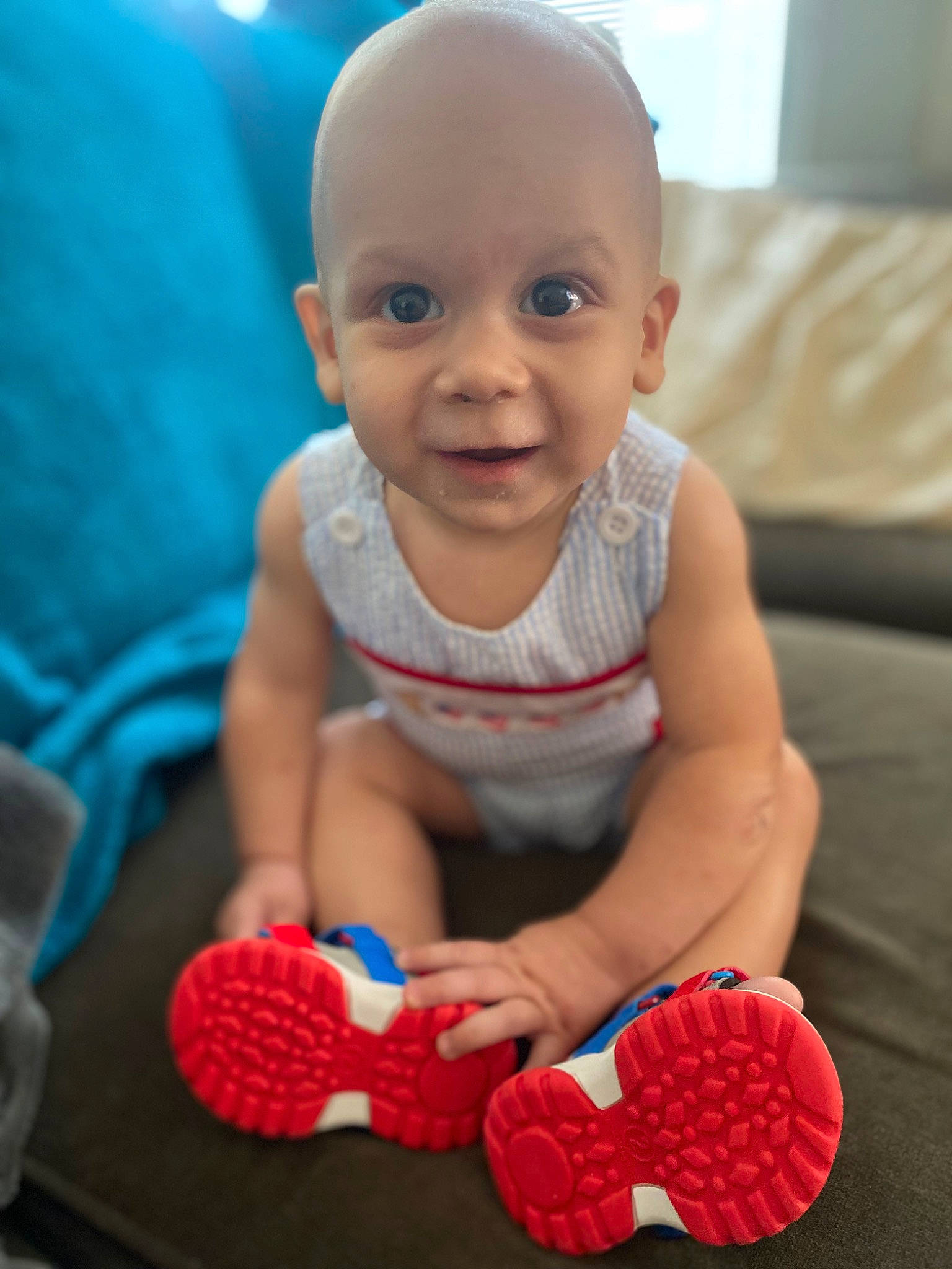 Jaxon joined the competition — help win amazing prizes! baby, baby_playing_with_toys, baby_toddler_clothing, cheek, child, close_up, finger, floor, flooring, fun, happy, human_leg, mouth, nose, person, red, skin, smile, toddler, toy