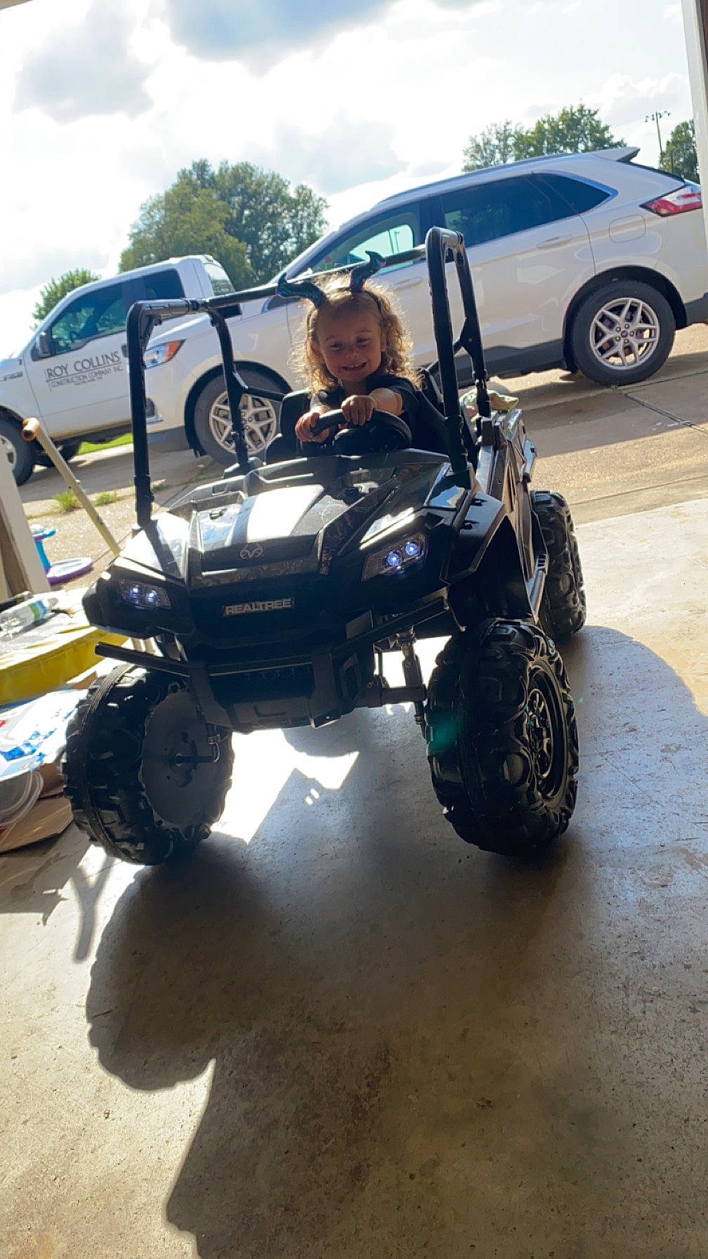 Brynlee joined the competition — help win amazing prizes! alloy_wheel, automotive_design, automotive_exhaust, automotive_exterior, automotive_lighting, automotive_tire, bumper, car, fender, hood, joy, land_vehicle, motor_vehicle, person, rim, sky, synthetic_rubber, tire, tread, truggy
