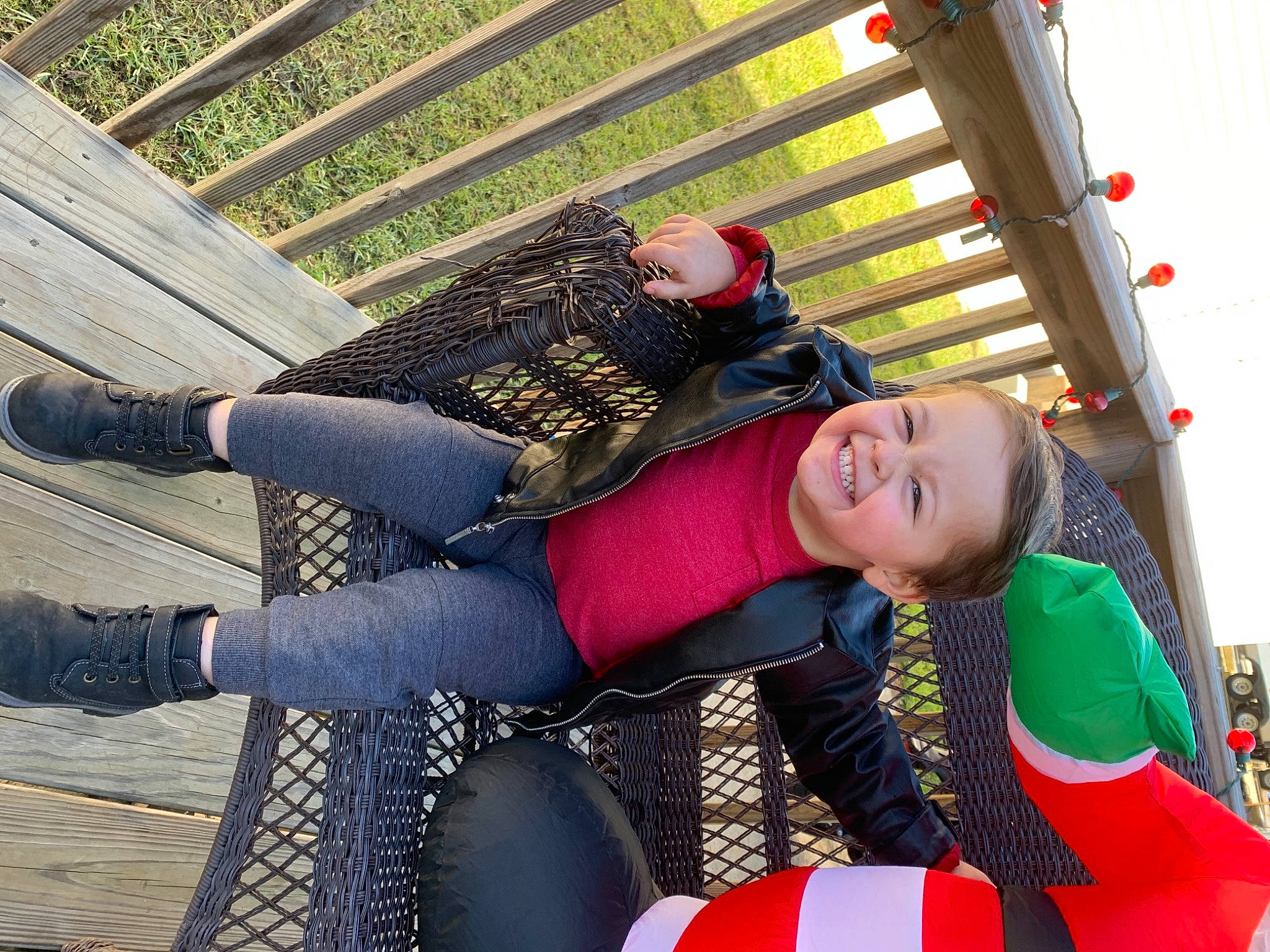 Keyten is registered to the contest to win money with this photo: bag, denim, fun, grass, happy, human_leg, joy, knee, leisure, luggage_and_bags, pattern, person, recreation, sandal, shoe, sitting, smile, sneakers, street_fashion, thigh