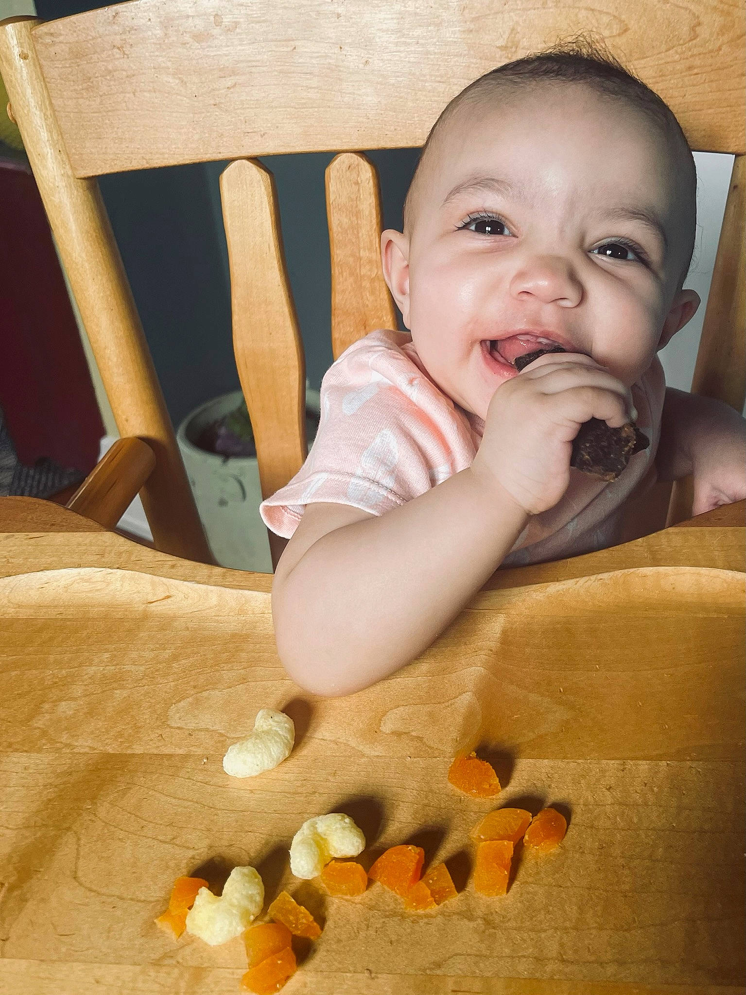 Nova is registered to the contest to win money with this photo: baby, baby_toddler_clothing, chair, cheek, chin, comfort, finger, gesture, happy, head, iris, lip, mouth, nose, orange, person, product, skin, smile, toddler