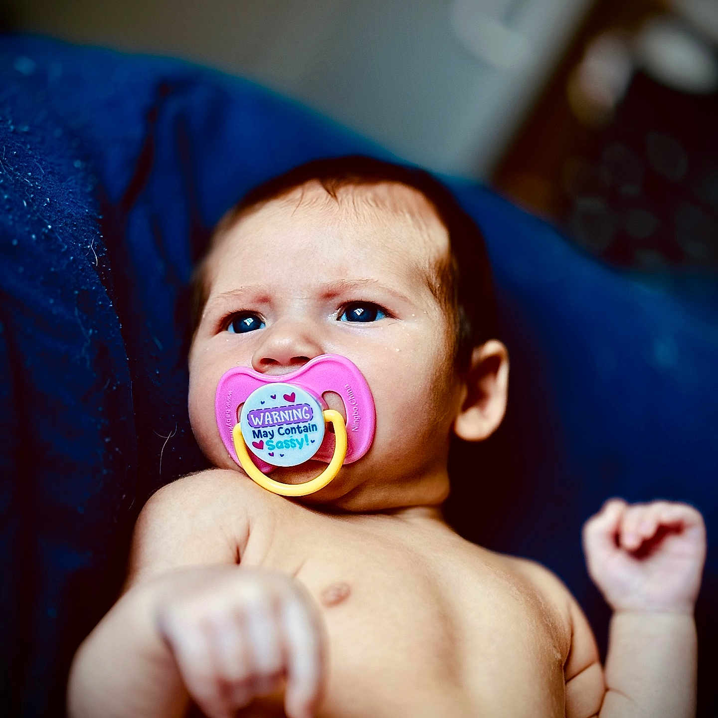 Raelynn is registered to the contest to win money with this photo: arm, baby, bed, bodypart, couch, face, finger, furniture, hand, head, logo, mouth, newborn, person, photography, portrait, purple, toe, wrist