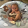 Wesley joined the competition — help win amazing prizes! baby, infant, cushion, plush_toy, carpet, hand, foot, animal_print, blanket, toy, indoor, child, cute, comfort, playful, floor, carpeted_floor, wood_floor, wooden_board, relaxing